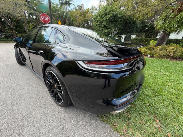 Black Porsche Panamera, rear three-quarter view